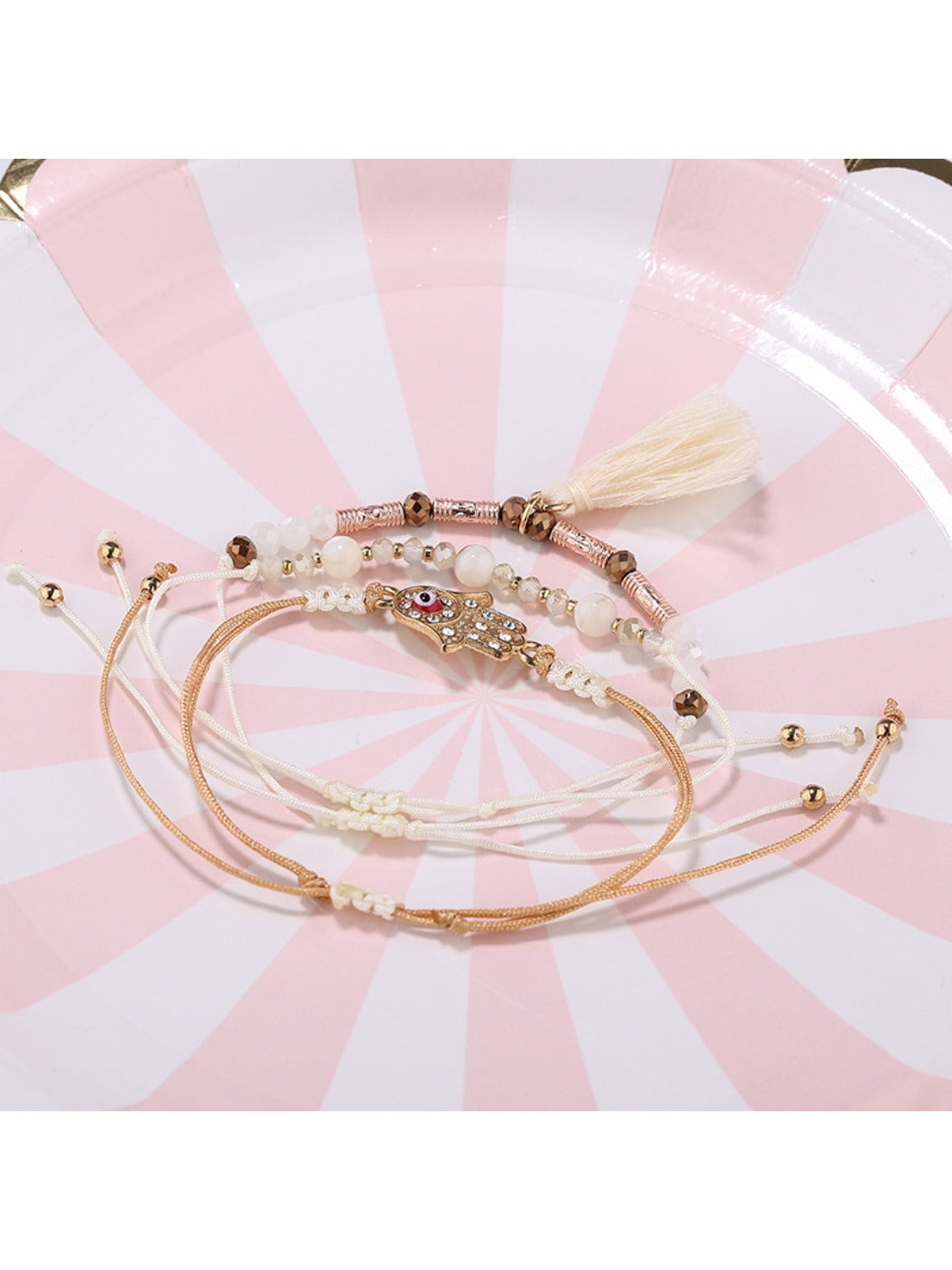Lovra bracelet showing detailed alloy charm and tassel pendant