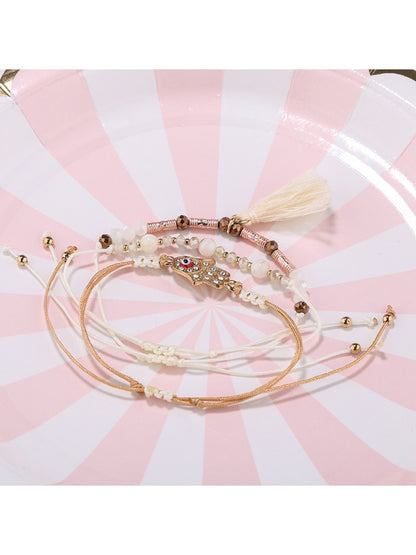 Lovra bracelet showing detailed alloy charm and tassel pendant