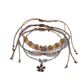 Lovra small bead bracelet styled with other jewelry pieces on wrist