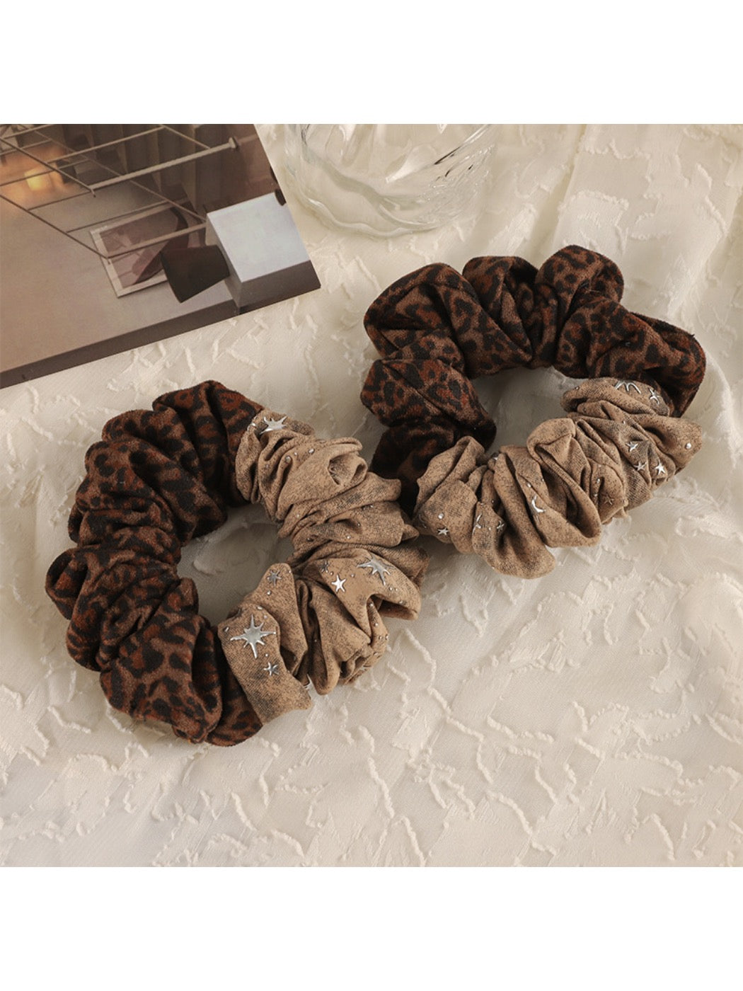 Gifty modern retro aesthetic scrunchie in pastel pink fabric on white background