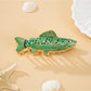 Side view of fish shaped hair clip showing metal clasp and engraved personalization