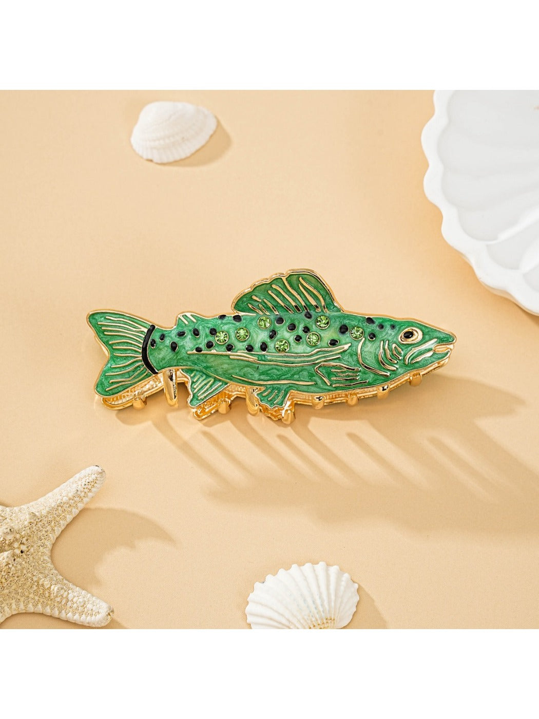 Side view of fish shaped hair clip showing metal clasp and engraved personalization