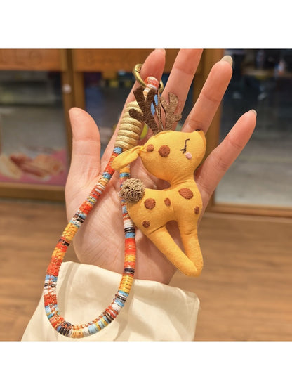 Top view of the deer charm keychain highlighting the metal ring