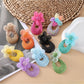 Close-up of Sweet Raffia Flower Shaped Stud Earrings on white background