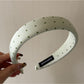 Gifty headband folded to show inner lining and stitching details