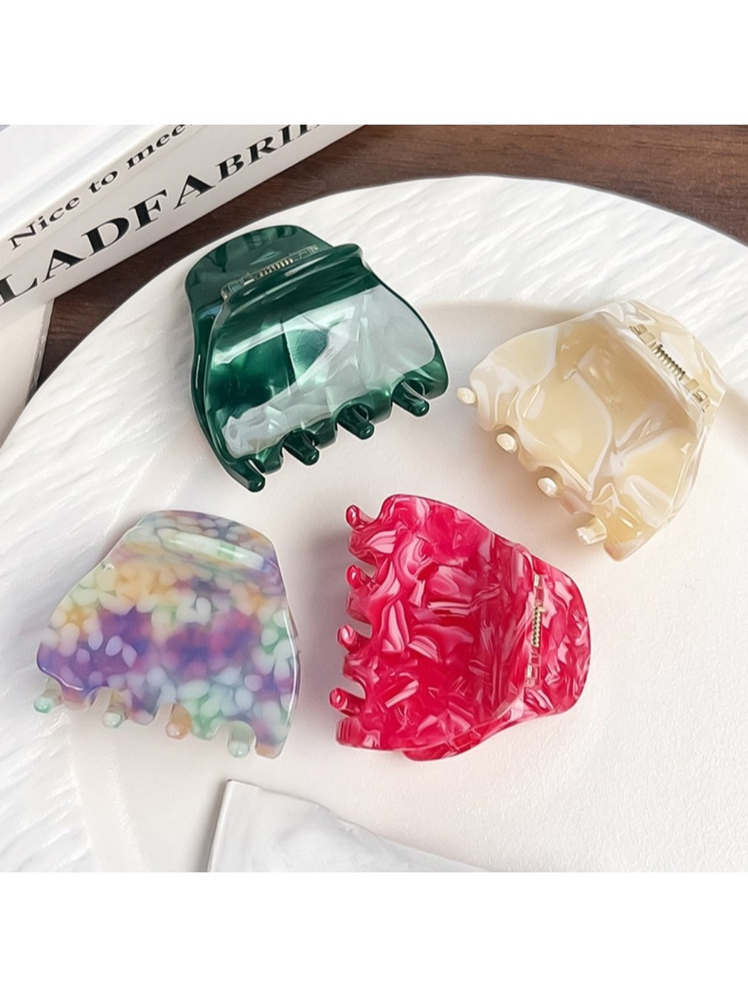 Top view of the colorful crescent claw clip displaying its smooth finish