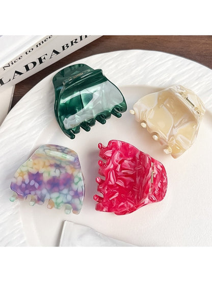 Top view of the colorful crescent claw clip displaying its smooth finish