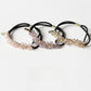 Close-up of Gifty chic beaded hair tie with multicolored beads on elastic band