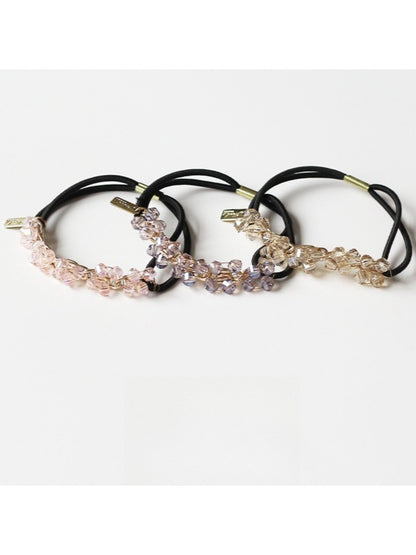 Close-up of Gifty chic beaded hair tie with multicolored beads on elastic band
