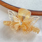 Top view of Beau butterfly hair claw clip highlighting intricate design