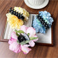 Beau peony flower claw clip showing side profile and curved claw teeth