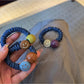 Gifty - Cute Smiley Face Hair Tie
