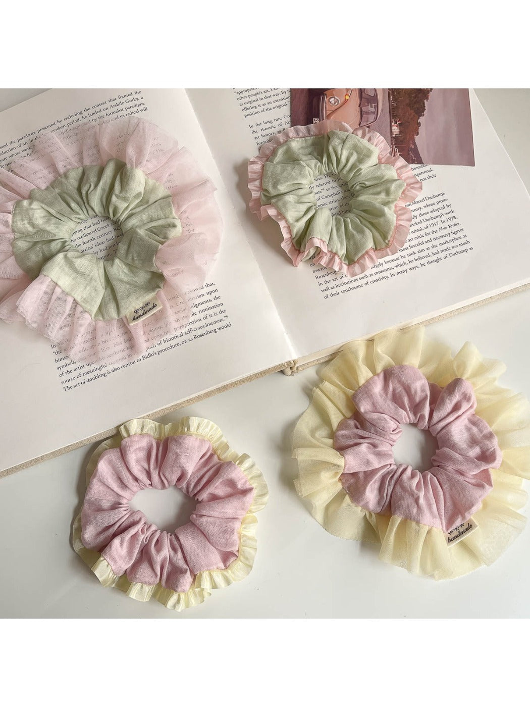 Gifty Sweet Color Block Tulle Scrunchie worn on a wrist with soft pastel colors