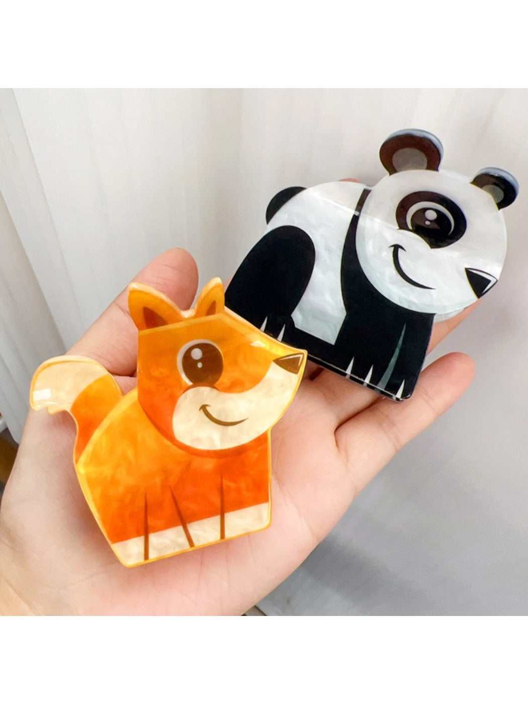 Beau hair claw clip with a bear face design on a white background