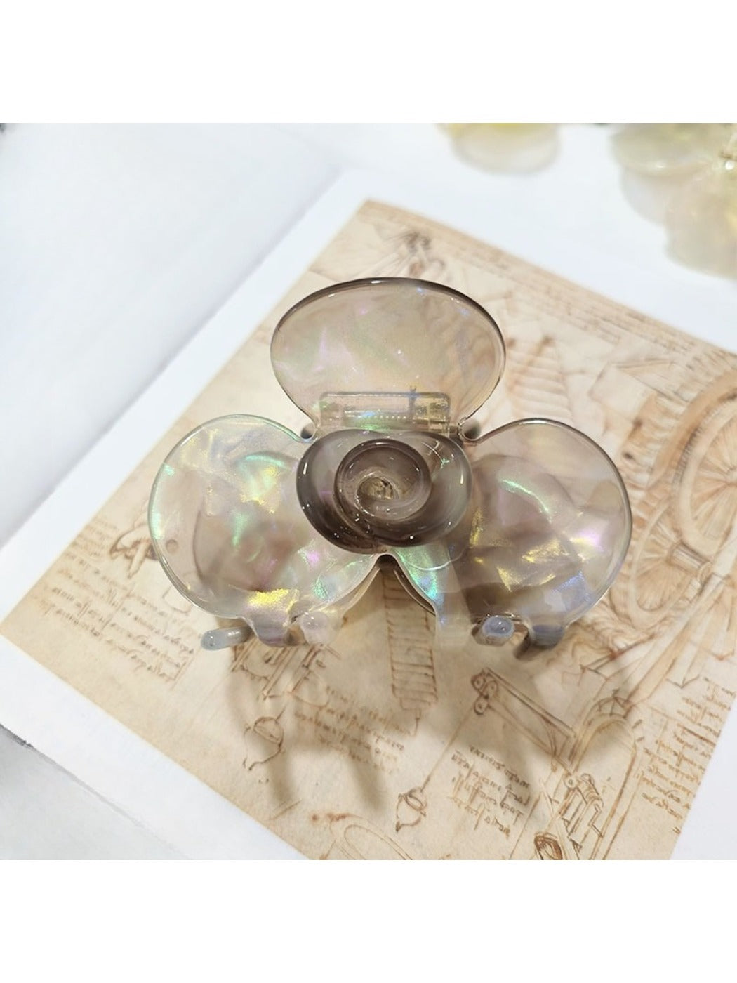 Beau Sweet Acetate Medium Flower Claw Clip shown from top view highlighting flower design