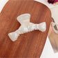 Top view of Beau bow shaped claw clip showing symmetrical design