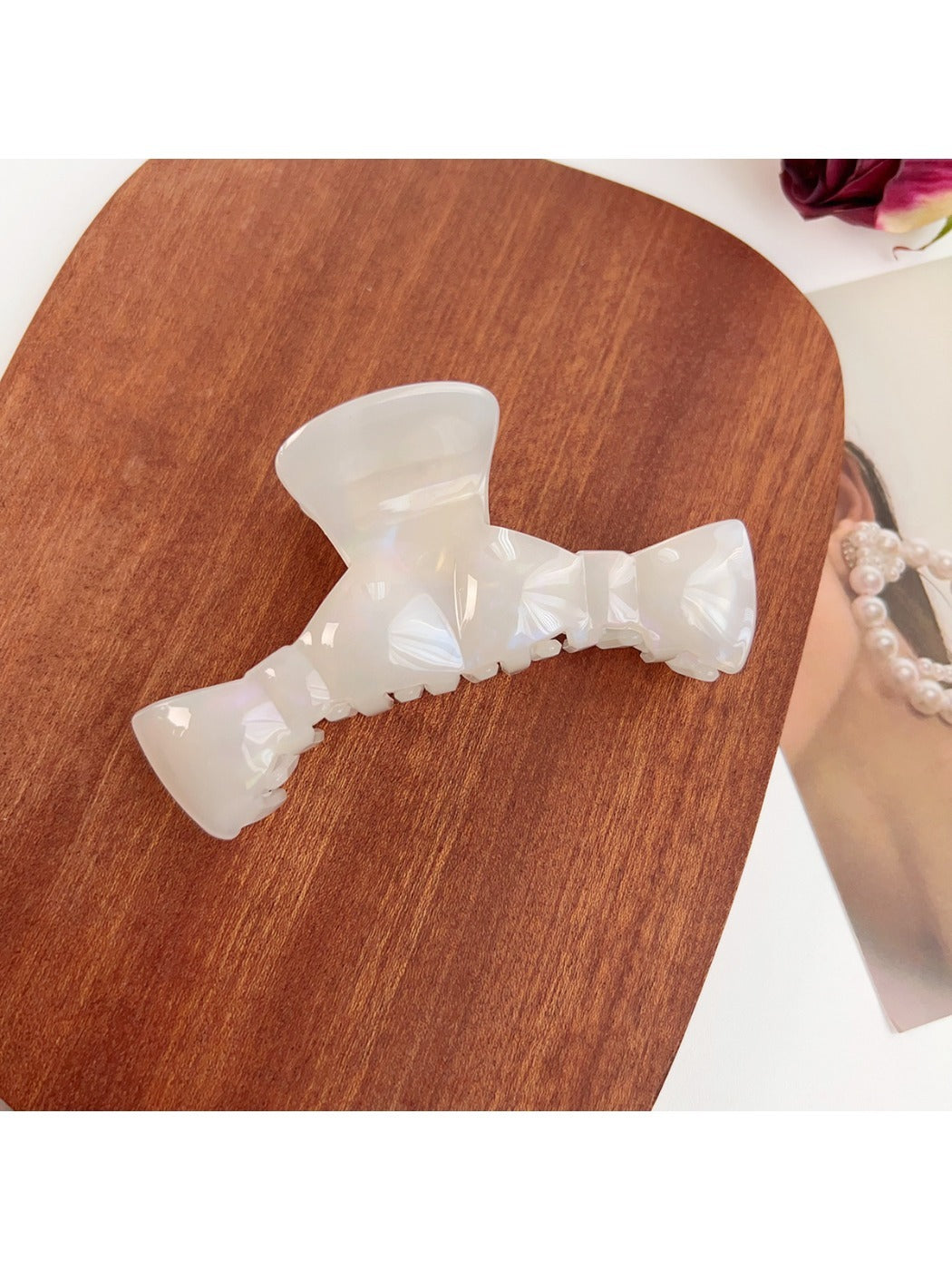 Top view of Beau bow shaped claw clip showing symmetrical design