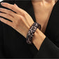 Lovra leopard print bangle bracelet shown with a soft shadow on a neutral background