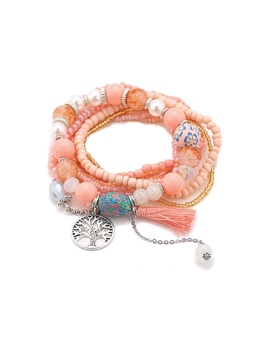 Lovra bracelet with tassel pendant and beads arranged in a circular pattern on a flat surface