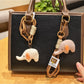 Close-up of Keypus adorable elephant charm keychain with silver ring