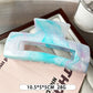 Beau marble pattern square claw clip displayed alongside matching hair accessories