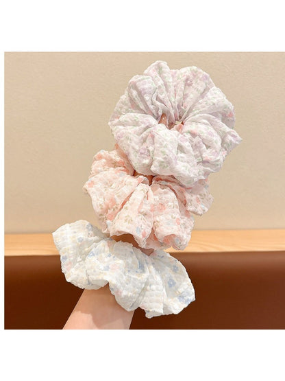 Close-up of Gifty sweet tiny floral print scrunchie on white background
