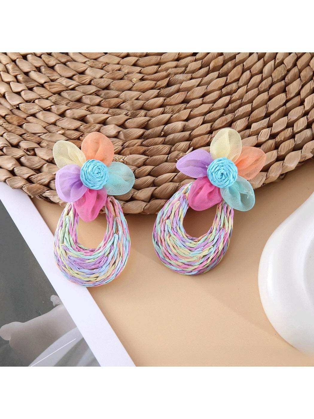 Side view of Sweet Raffia Flower Shaped Stud Earrings showing texture and detail