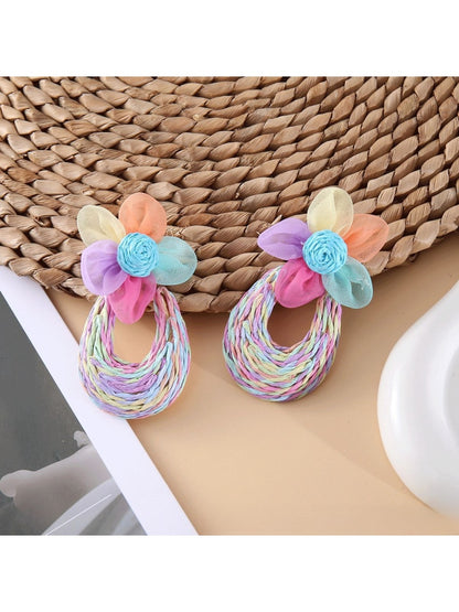 Side view of Sweet Raffia Flower Shaped Stud Earrings showing texture and detail