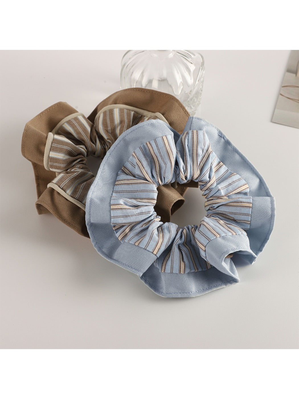 Gifty pastel scrunchie styled on a wrist as a fashion accessory