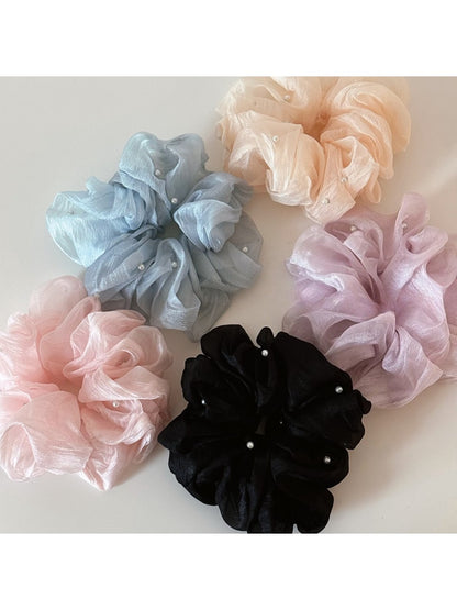 Close-up of Gifty Comfy Foggy Simplicity scrunchie in soft pastel fabric