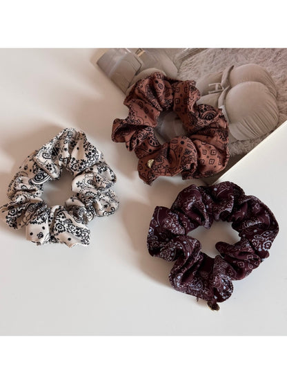 Gifty scrunchie displayed on a white background showing full circular shape and print