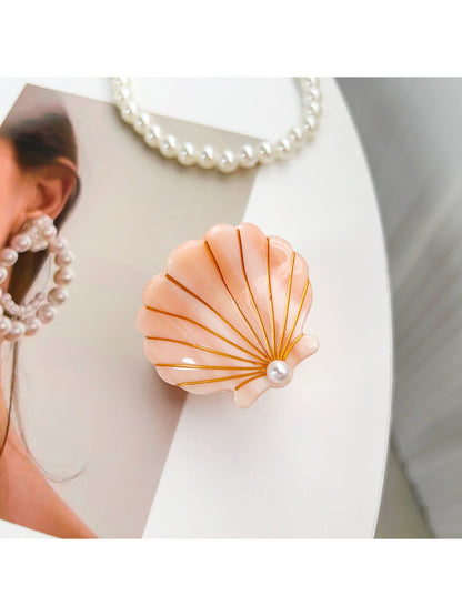 Beau hair claw clip styled in model's hair from back view