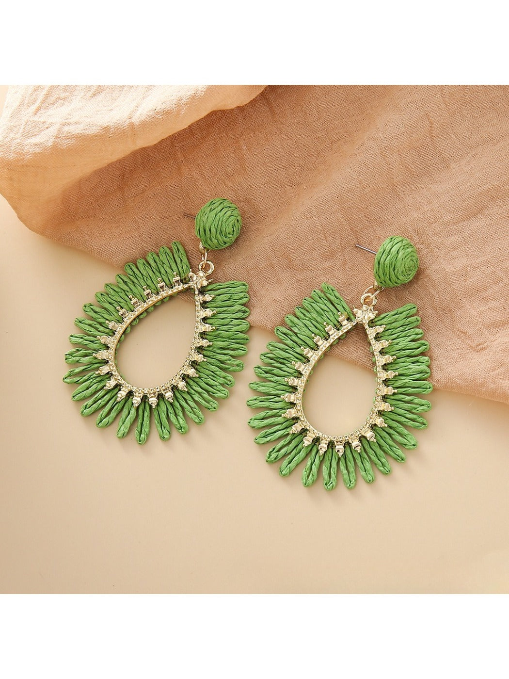 Earedge raffia teardrop hollow earrings shown with matching accessories