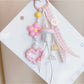 Close-up of pink mushroom keychain showing textured cap and smooth stem details