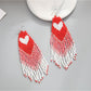 Earedge - Festive Heart Tassel Drop Earrings