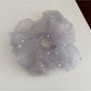 Gifty elegant chic tulle scrunchie folded to show its lightweight and sheer material