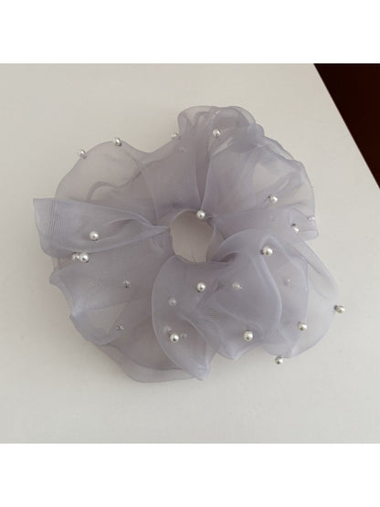 Gifty elegant chic tulle scrunchie folded to show its lightweight and sheer material