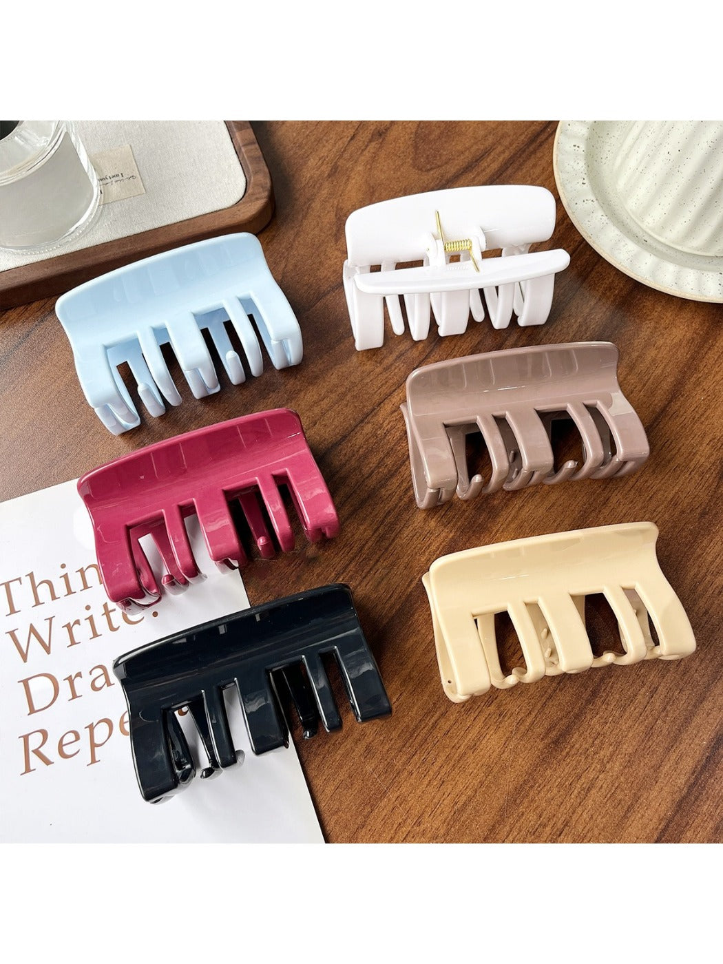 Beau plastic square claw clip open displaying teeth and grip