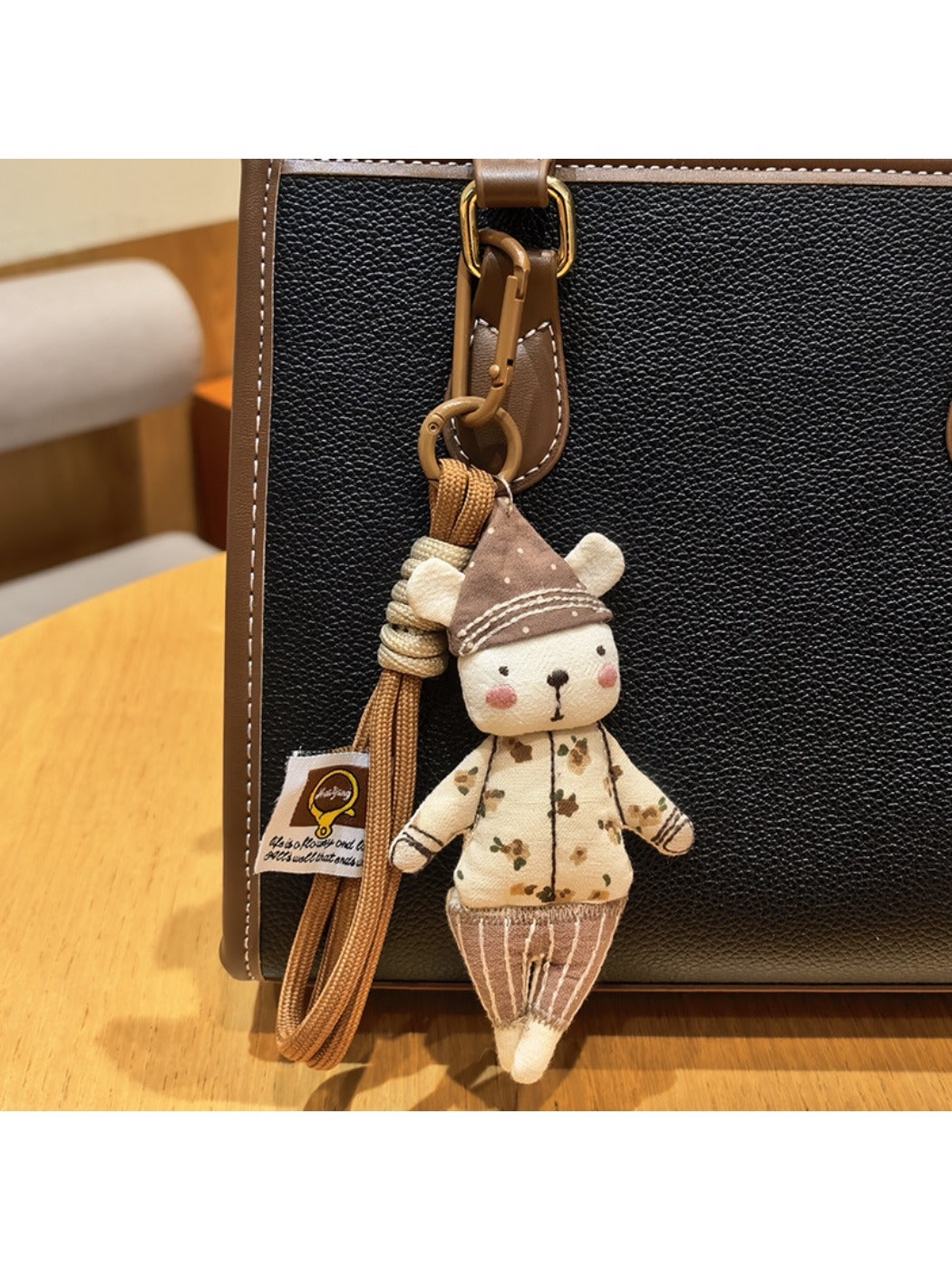 Top view of the bear keychain highlighting the hat design