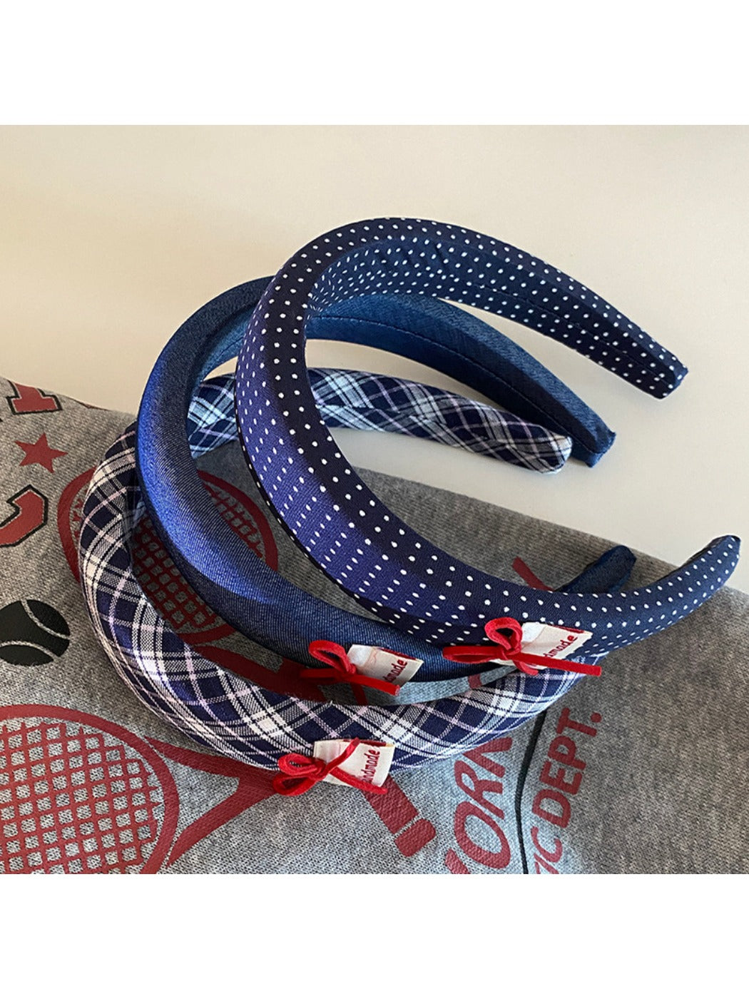 Blue fabric headband with a smooth finish and flexible fit