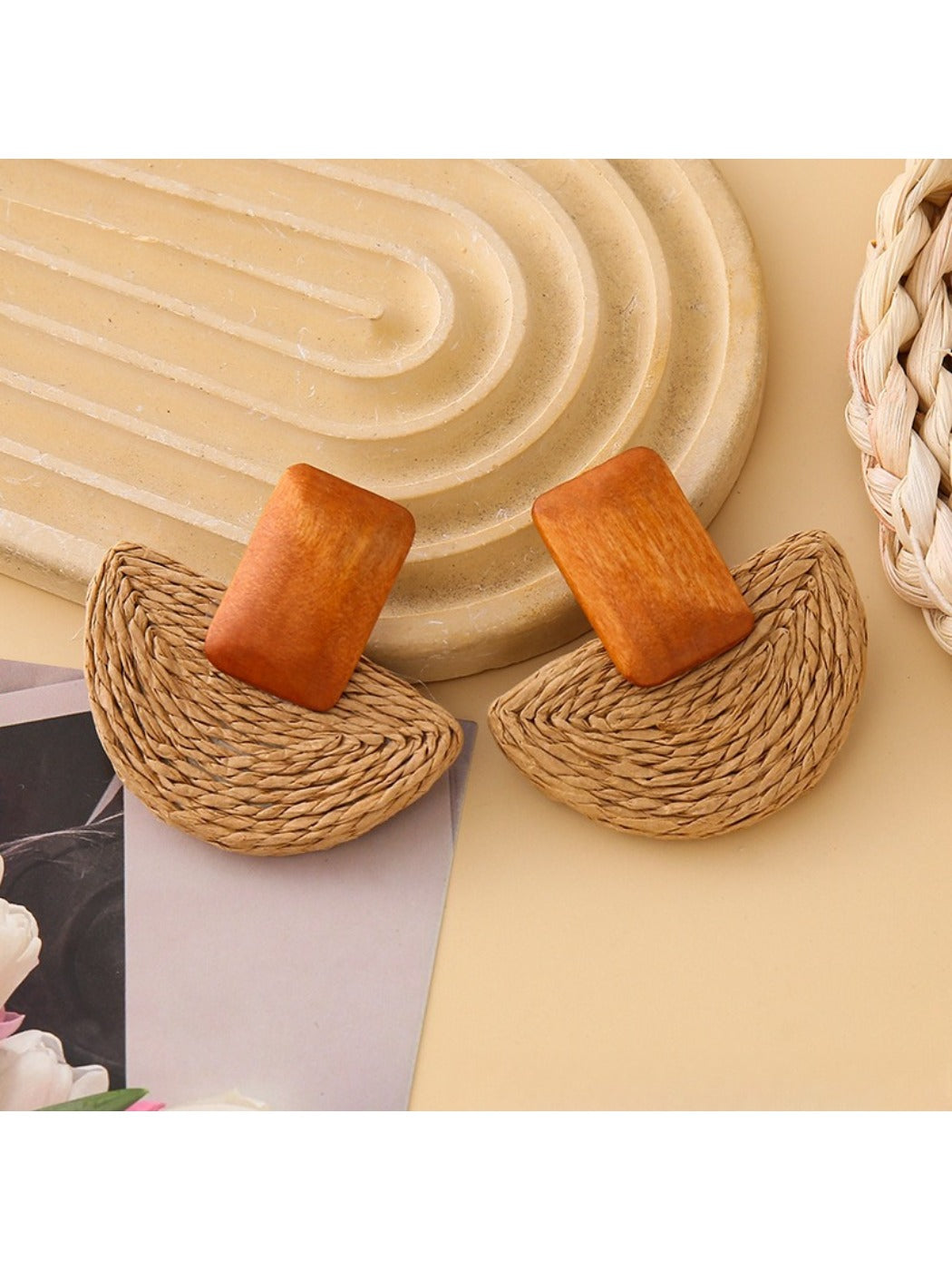 Side view of raffia mushroom shaped stud earrings showing texture and shape