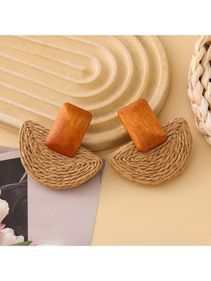 Side view of raffia mushroom shaped stud earrings showing texture and shape