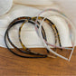 Side view of vintage leopard print hairband showing elastic band