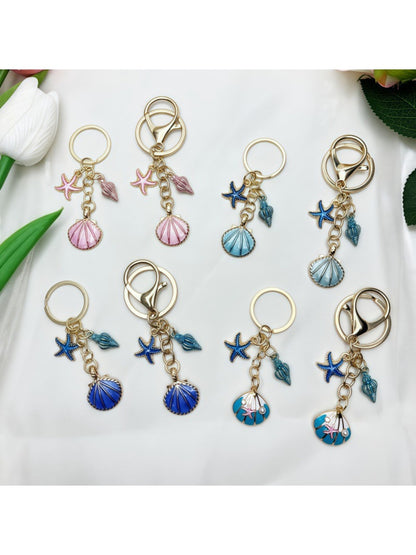 Close-up of Keypus marine inspired pendant keychain with blue and silver design