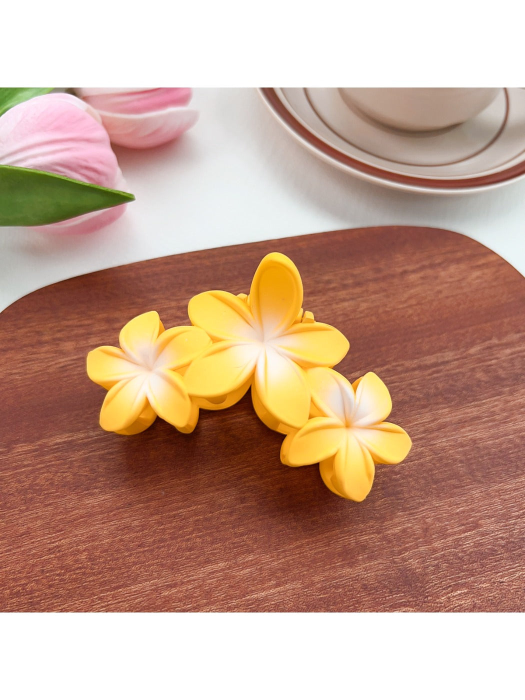 Model wearing Beau Sweet Three Flower Hair Claw Clip with loose hairstyle