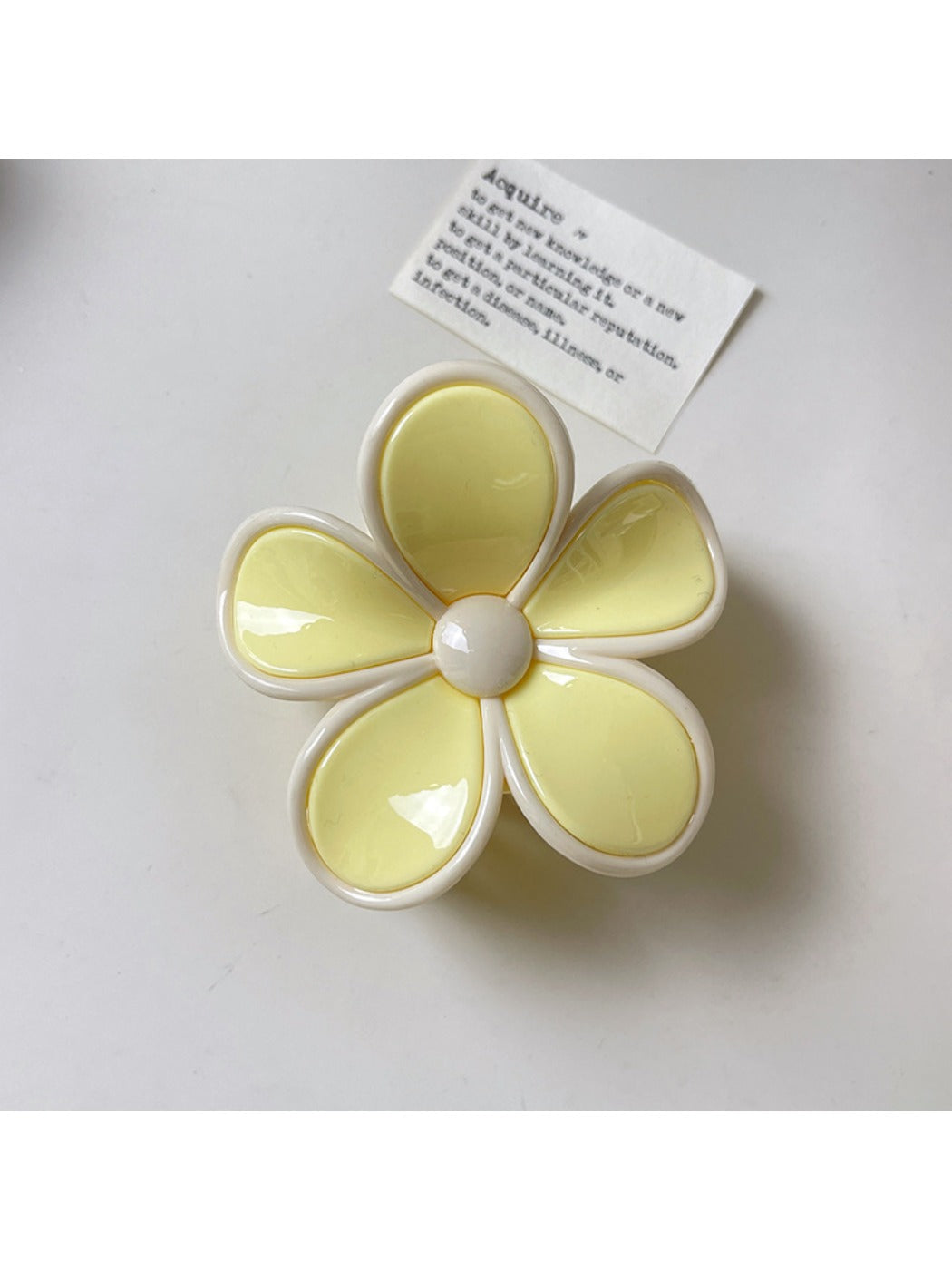 Beau claw clip displayed on a wooden surface with natural lighting