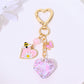 Rhinestone heart keychain held in hand to show size and sparkle
