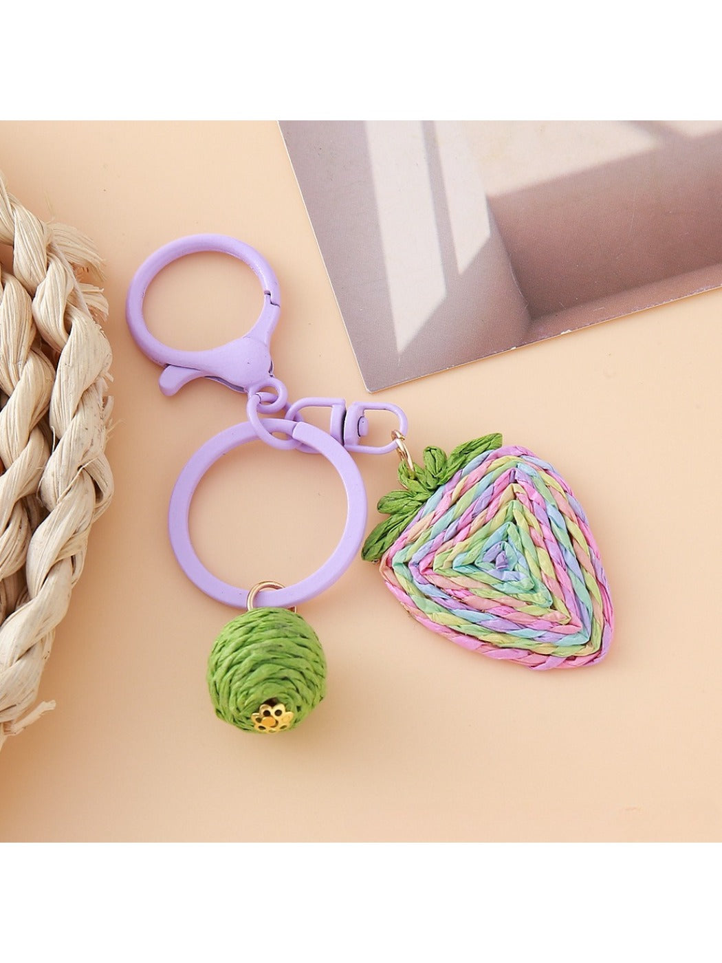 Side view of the strawberry charm showing its textured surface and vibrant colors