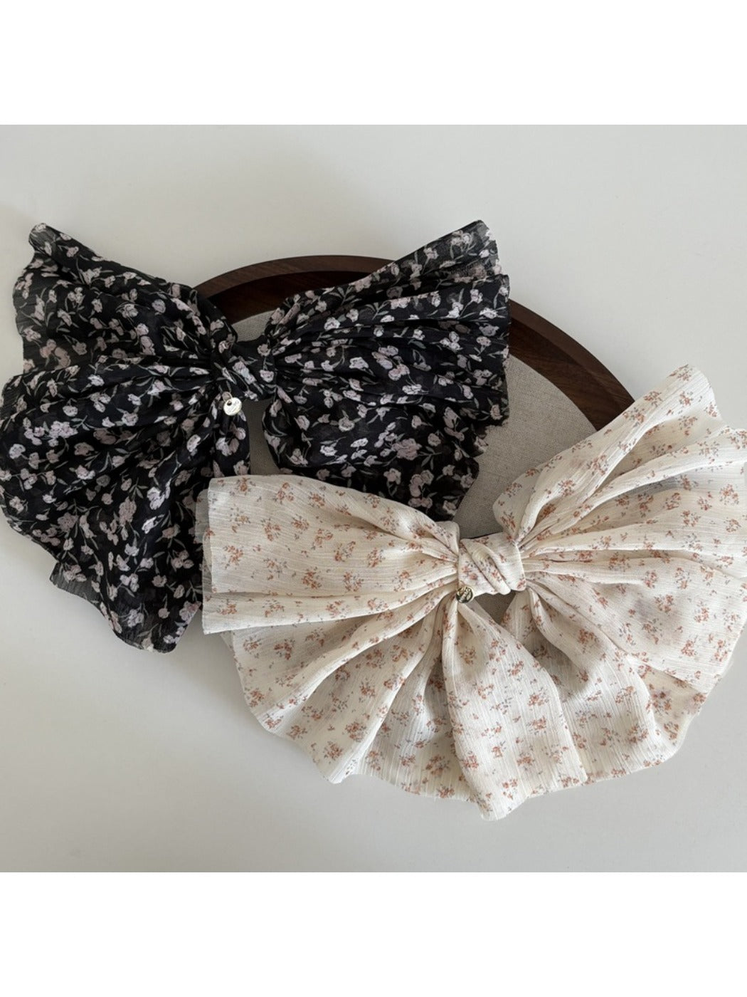Close-up of Beau chiffon bow hair clip showing fabric texture and stitching