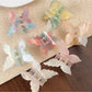 Side view of Beau gradient butterfly hair claw clip